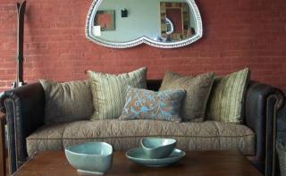 Living room with Leather couch, mirror, coffee table